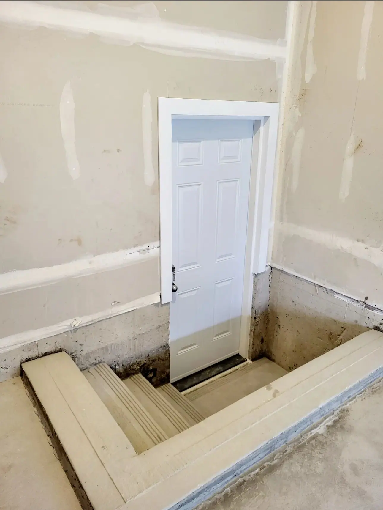 During construction: New basement stair opening framed during a basement renovation