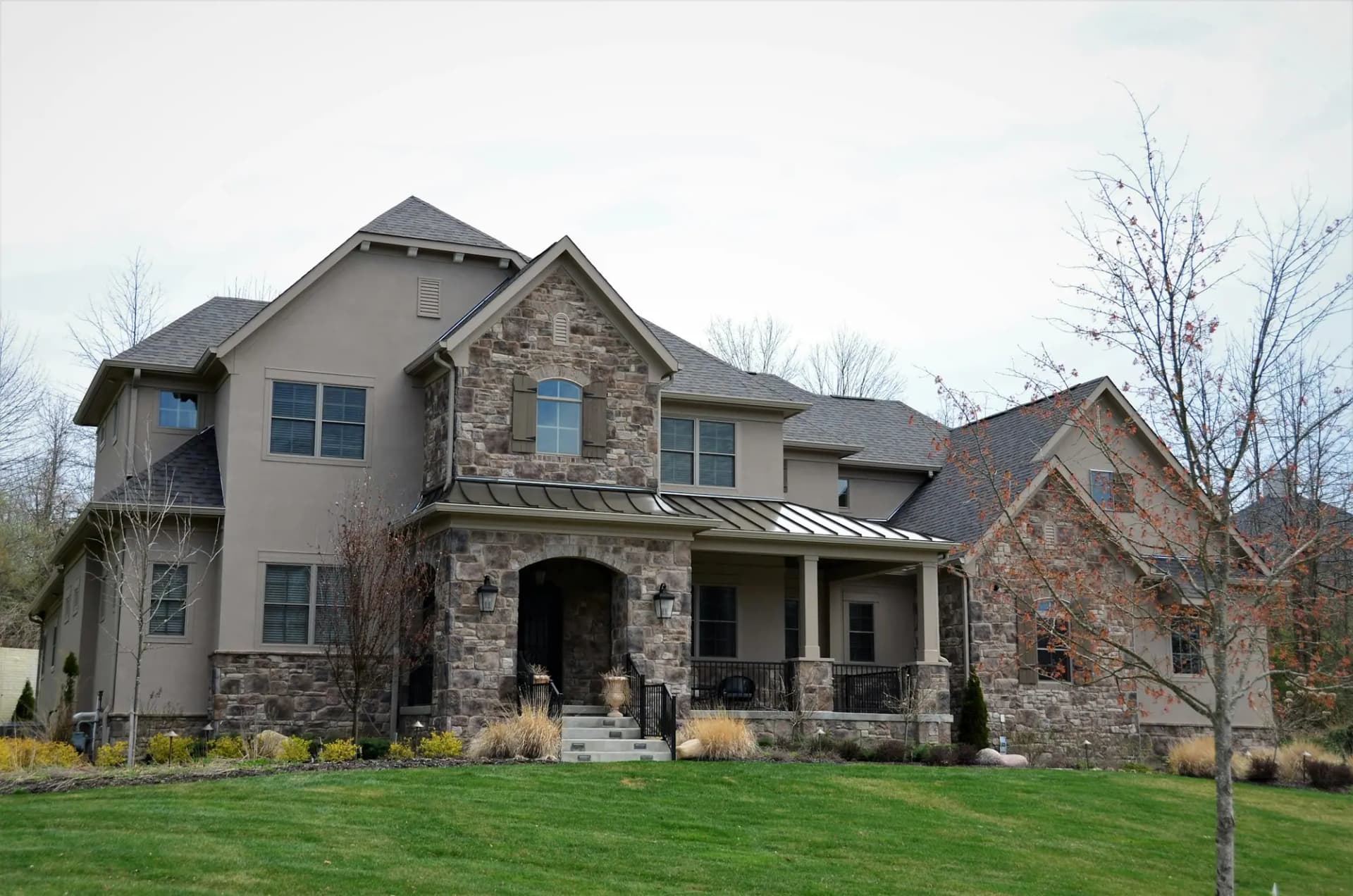 Two-storey custom home with stone and stucco exterior
