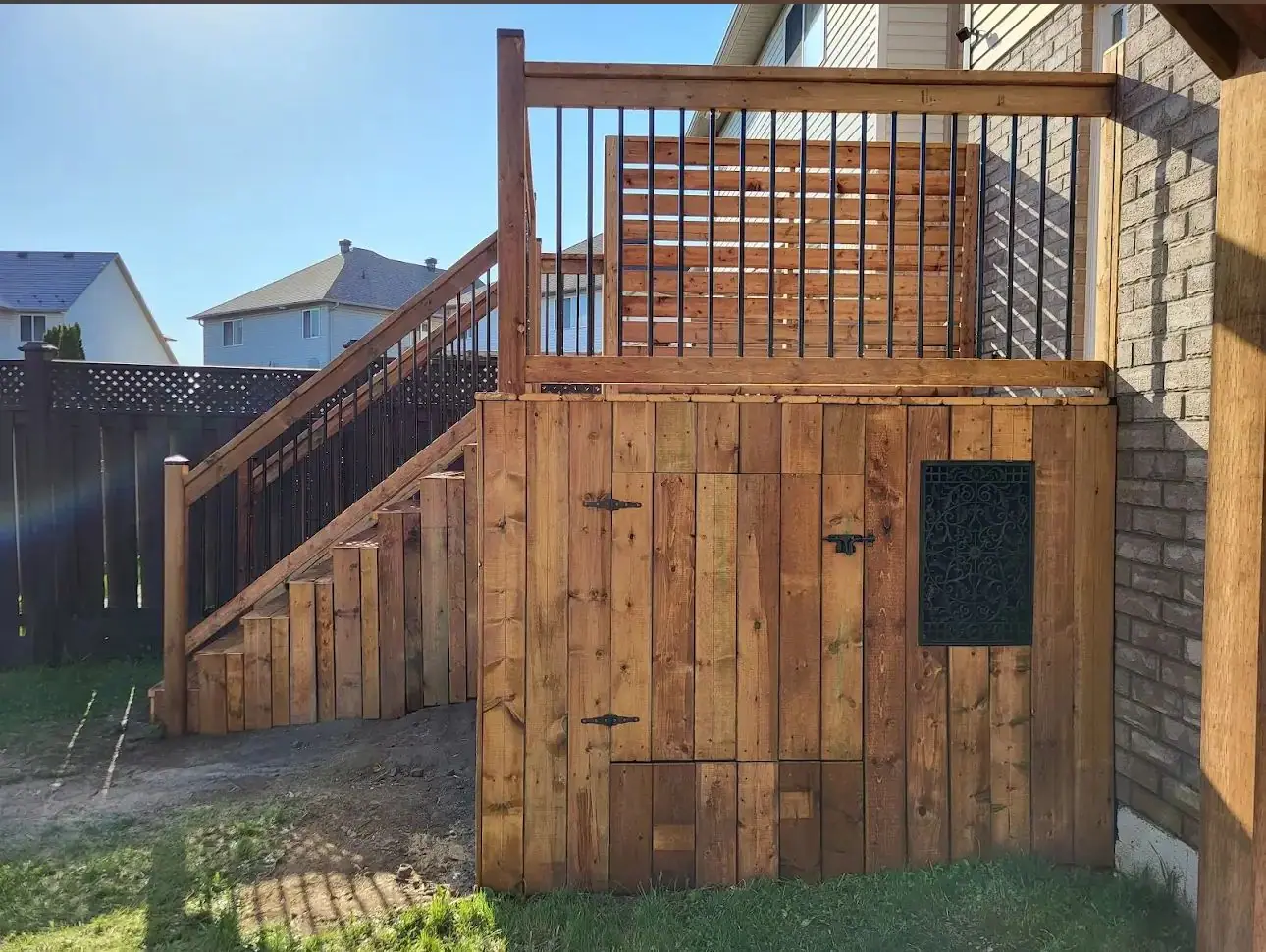 Elevated deck with a storage enclosure underneath