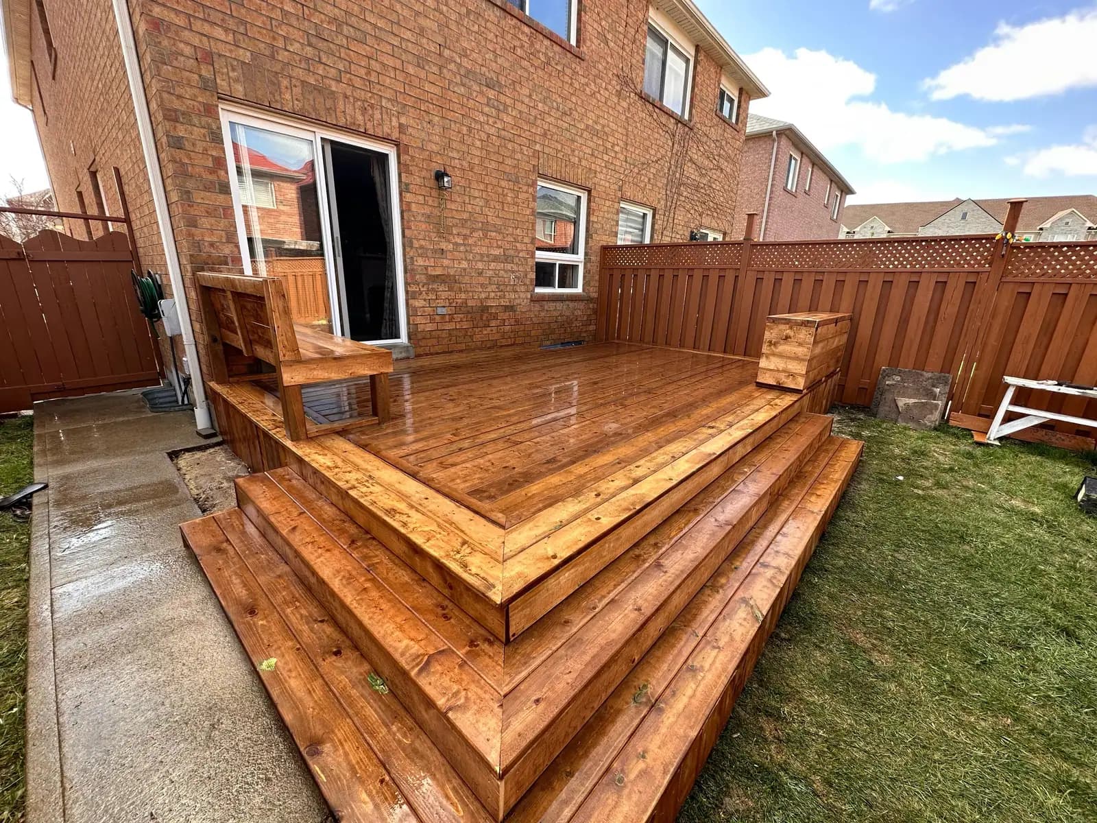 Multi-level pressure-treated deck with wide stairs
