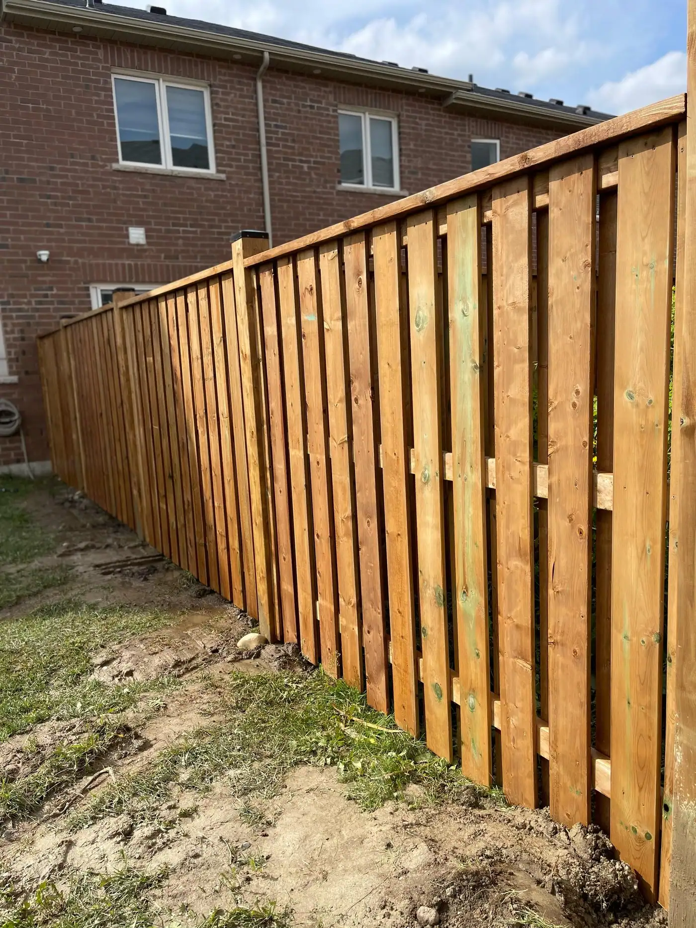 Board-on-board privacy fence in a new subdivision