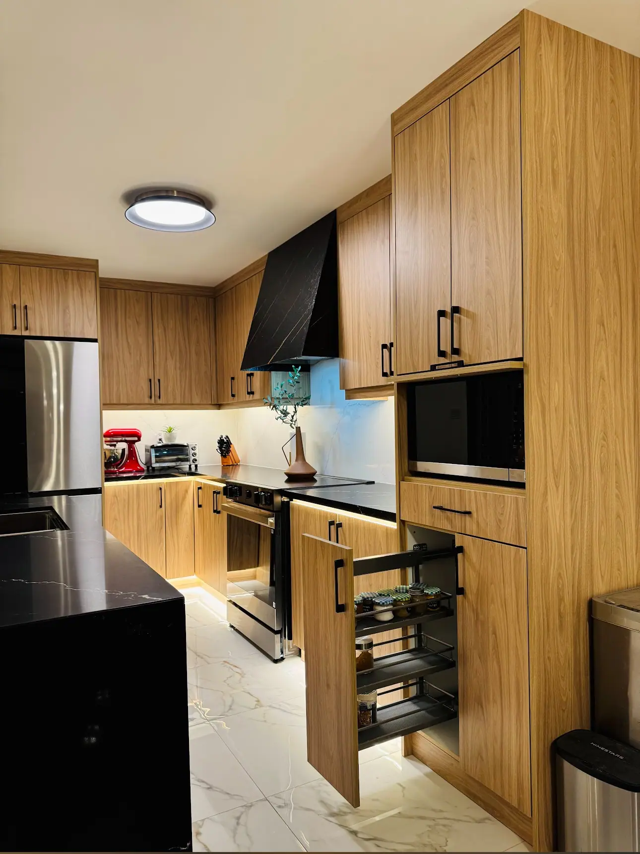Kitchen with oak cabinets, built-in microwave and wall oven