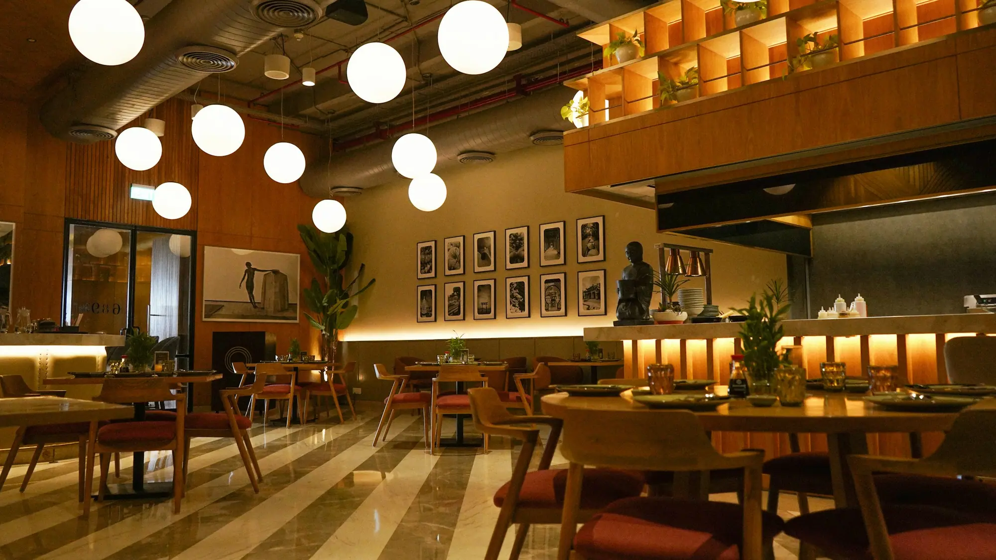 Café interior with patterned floor tile and bar seating