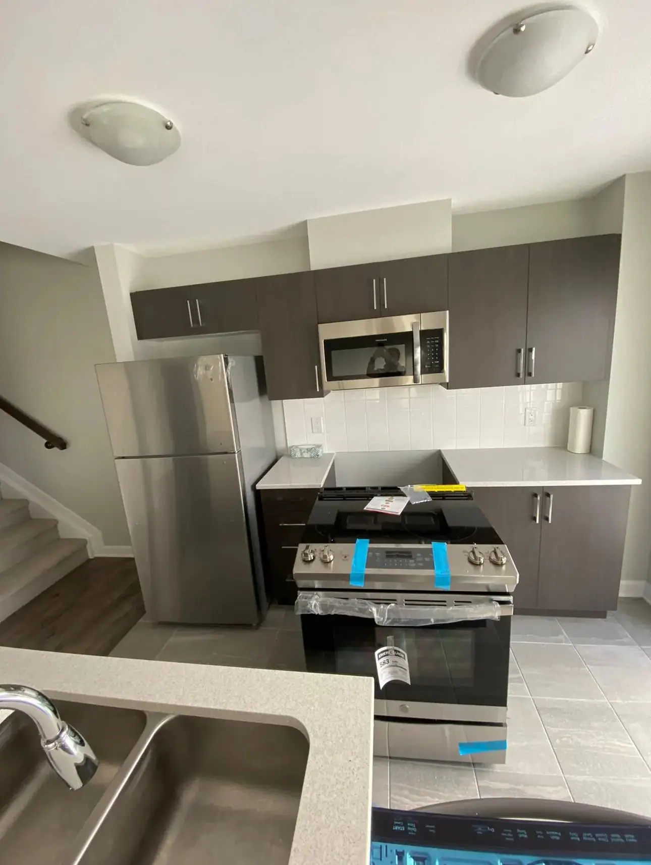 Basement suite kitchen under construction with new range and sink