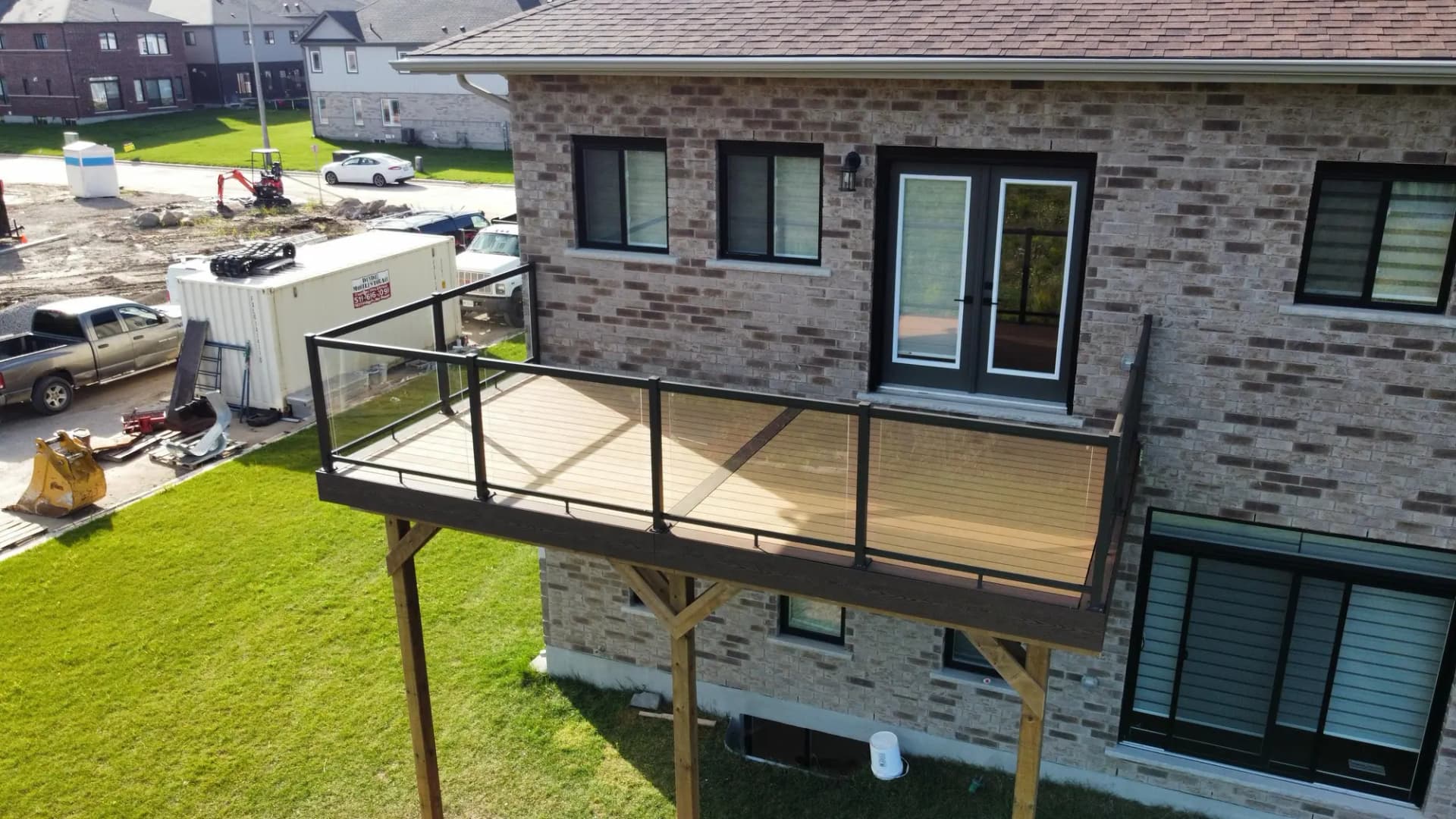 Second-storey deck with glass railing