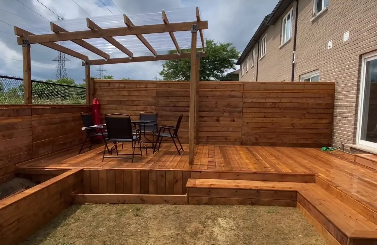 Wood deck with built-in benches and pergola
