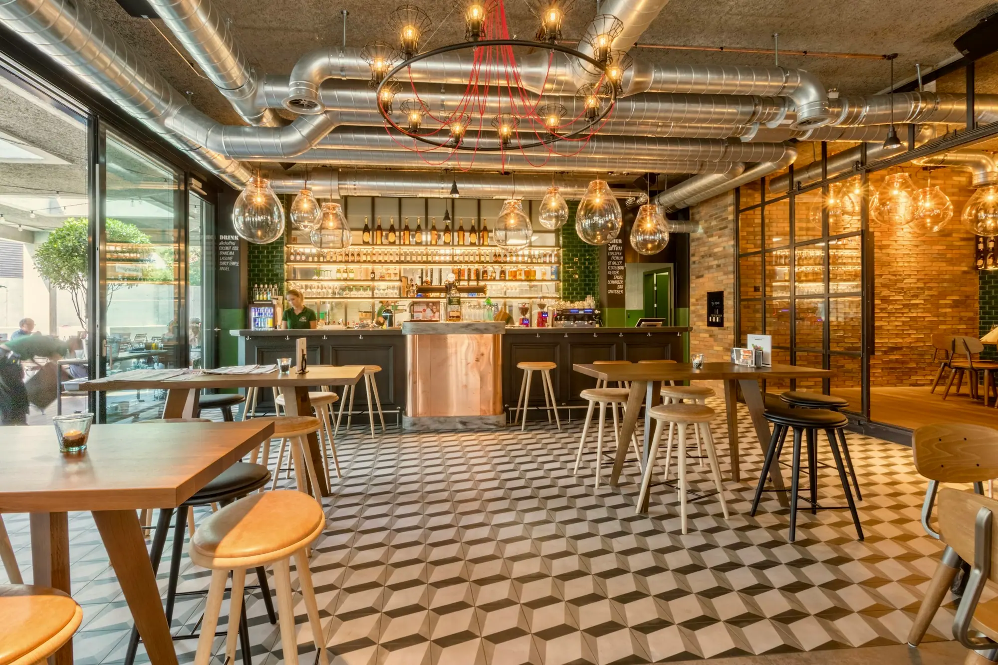 Restaurant dining room with warm lighting and banquette seating
